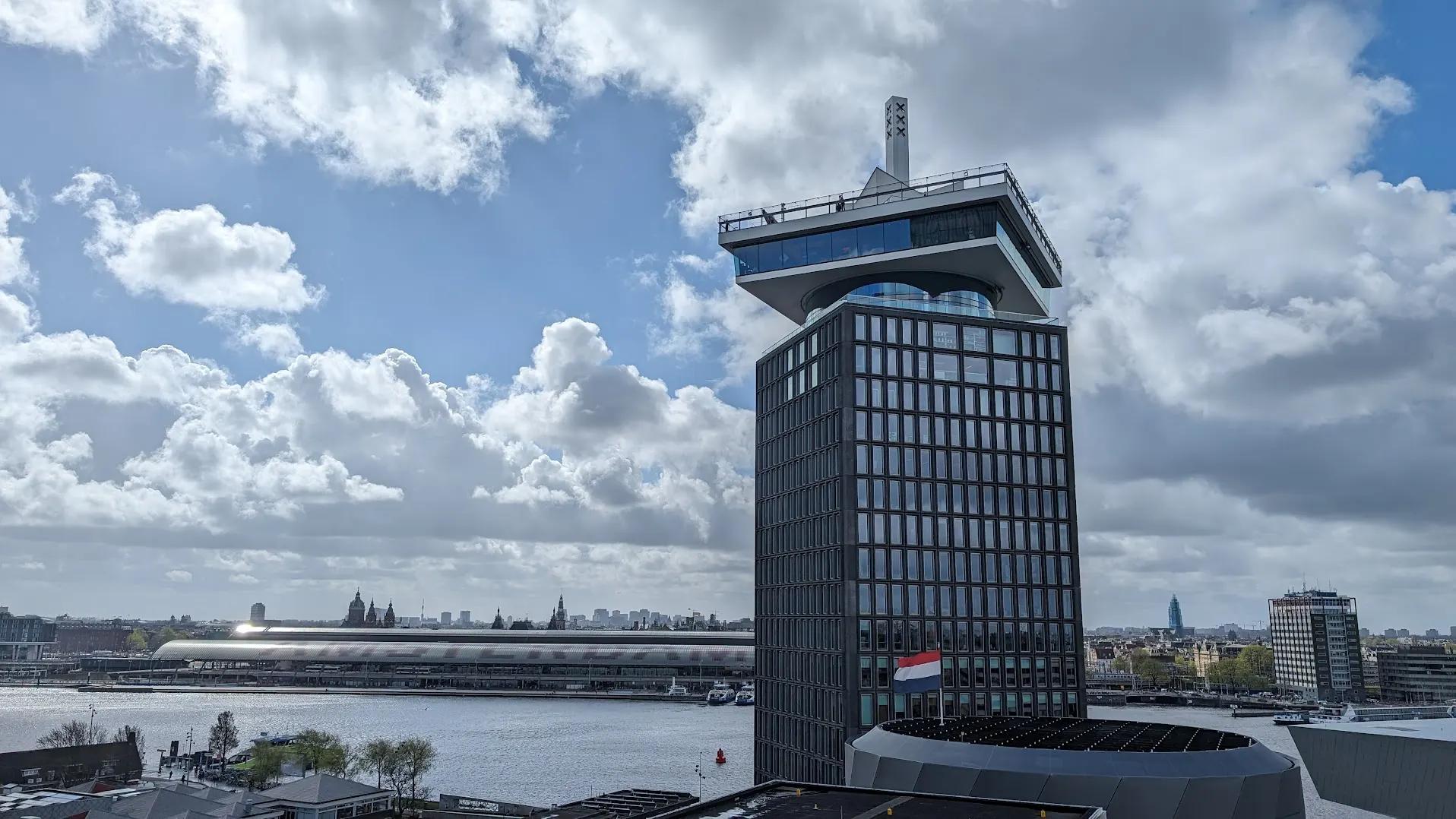 A'DAM Tower in Amsterdam Noord with Centraal Station and the city centre behind across the IJ
