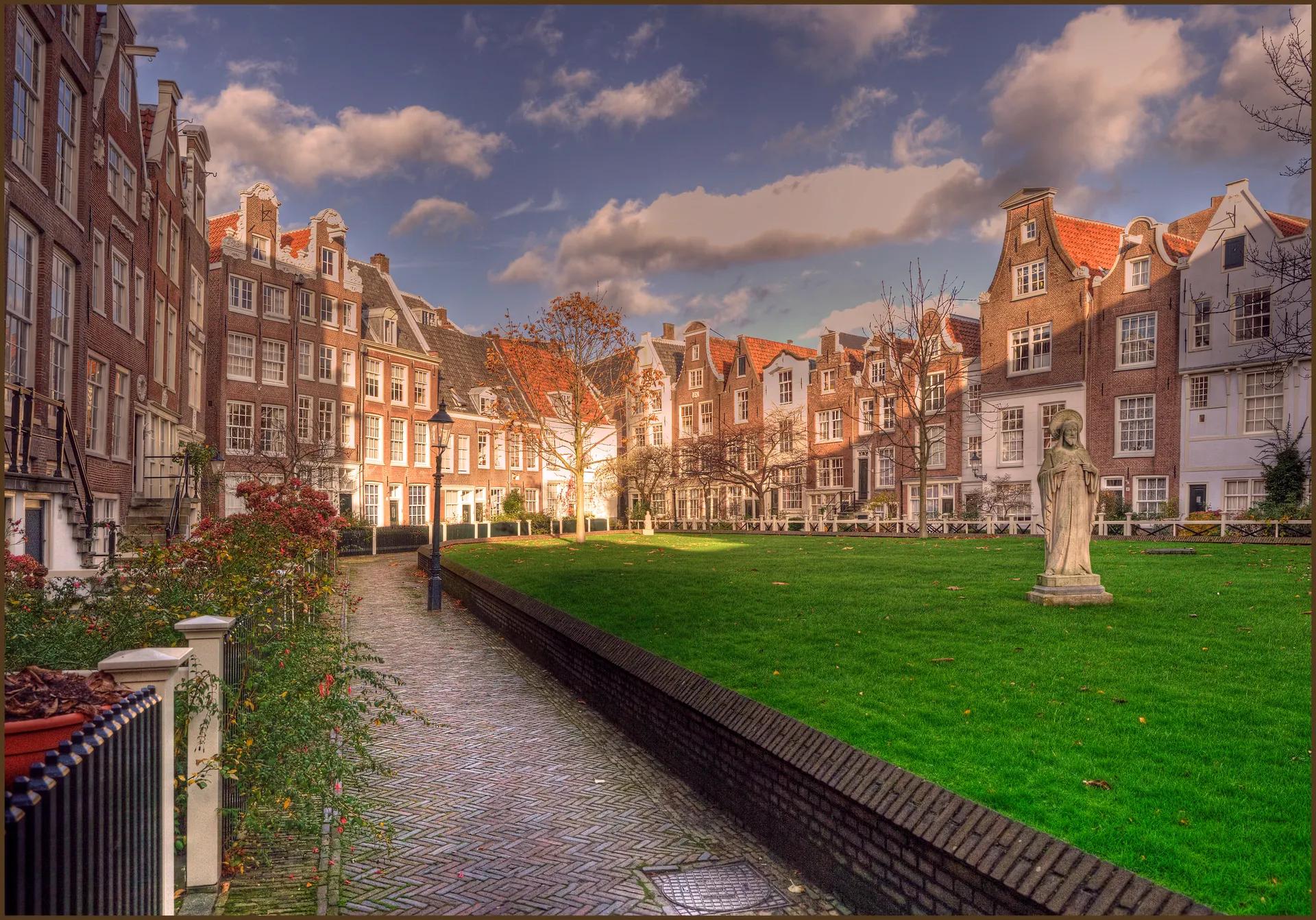 Historic gabled houses around the lawn of the Begijnhof courtyard