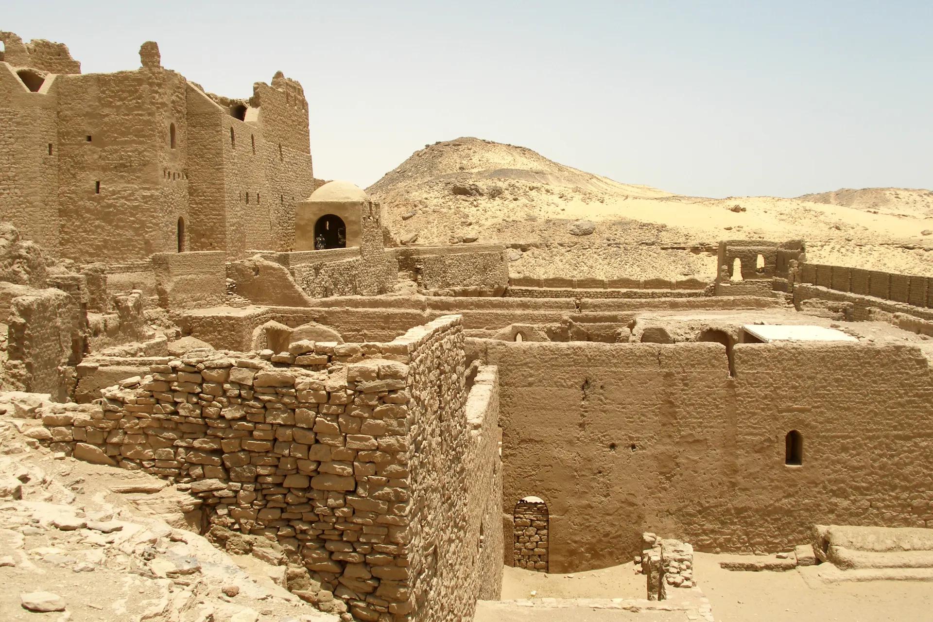 Mud-brick walls and towers of the Monastery of St Simeon in the desert west of Aswan