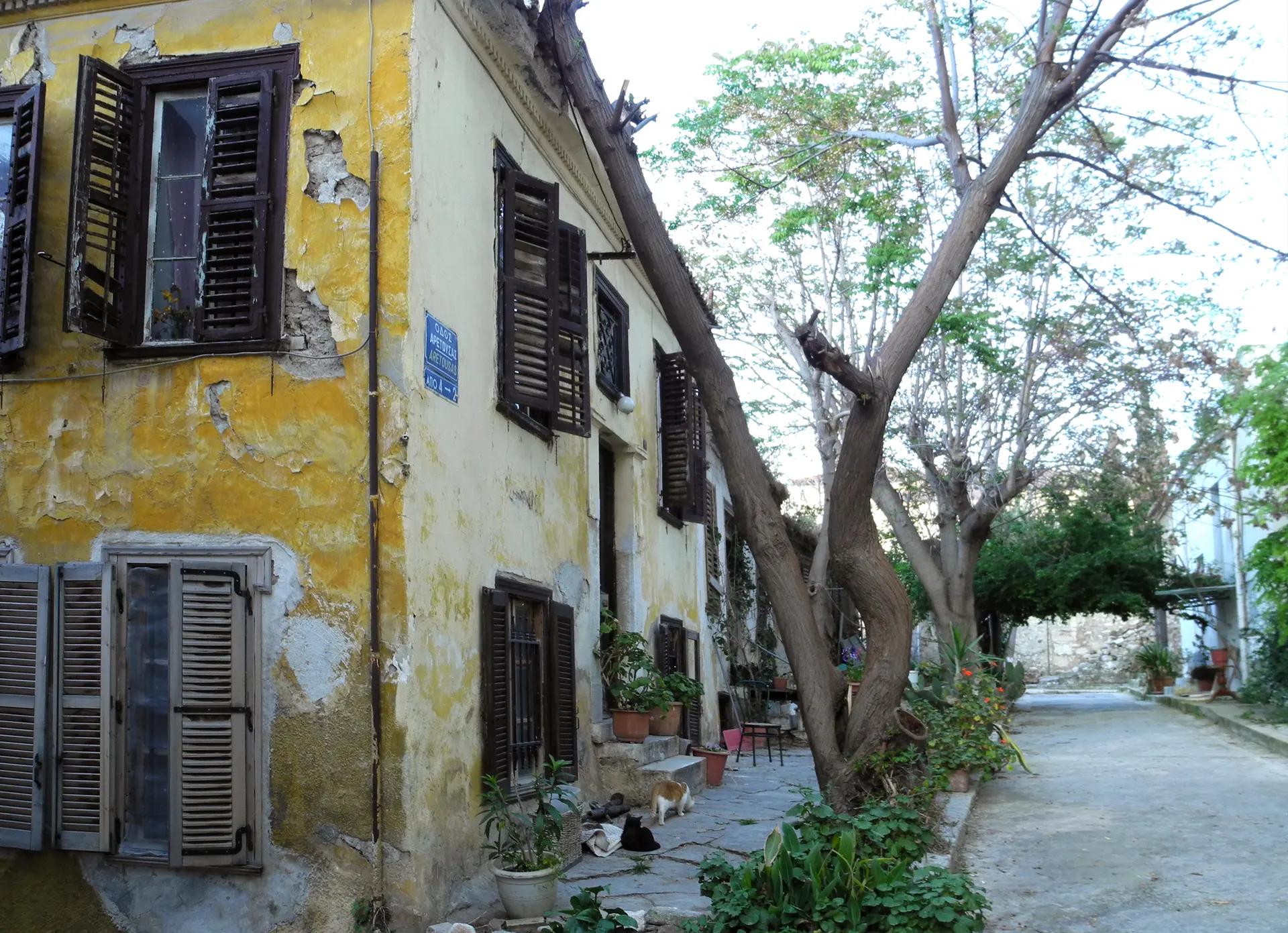 Old houses with wooden shutters on Aretousas Street in Anafiotika