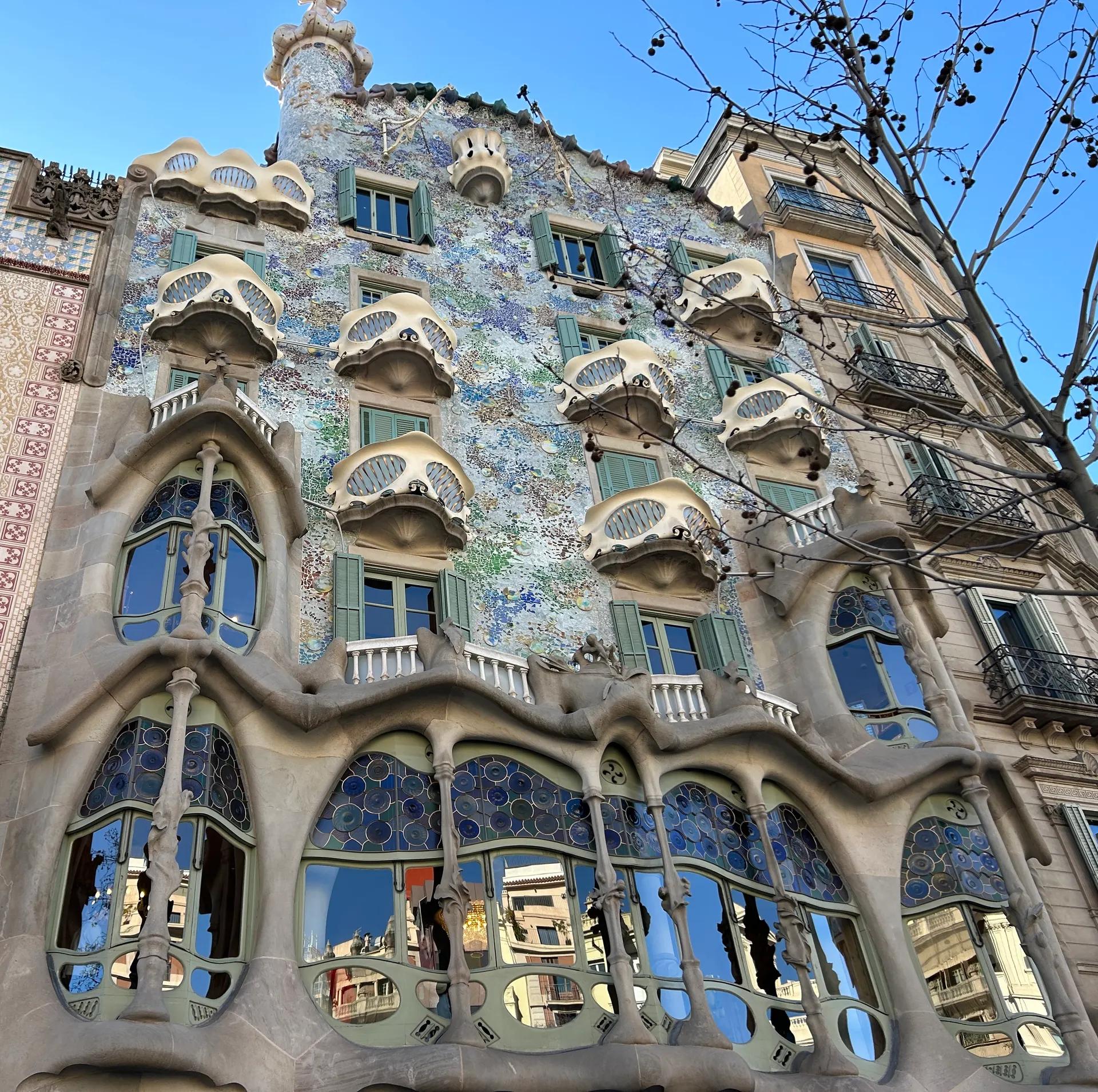Casa Batlló façade with mask-shaped balconies and mosaic tiles