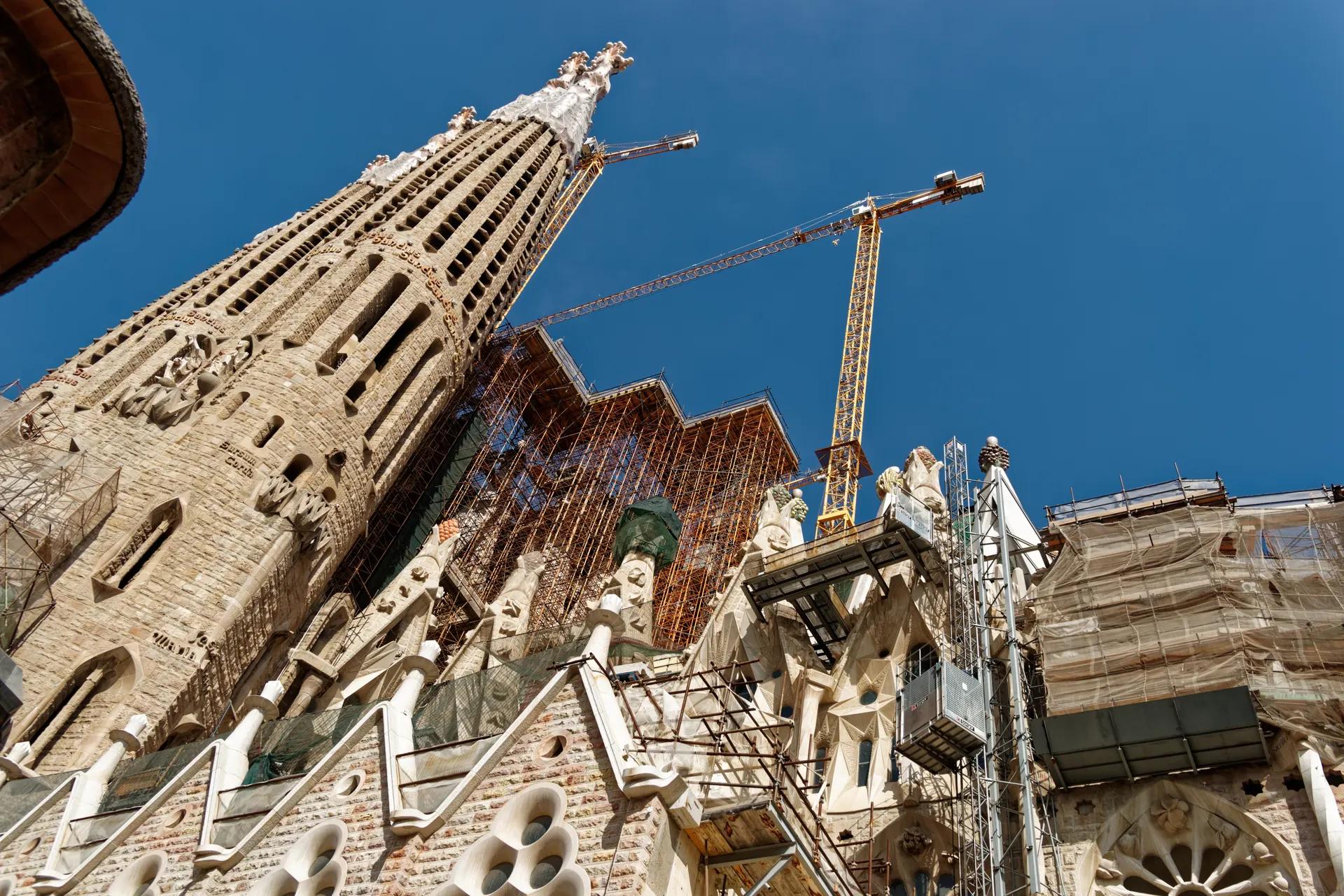 Towers of the Sagrada Família seen from the Passion façade side, with cranes
