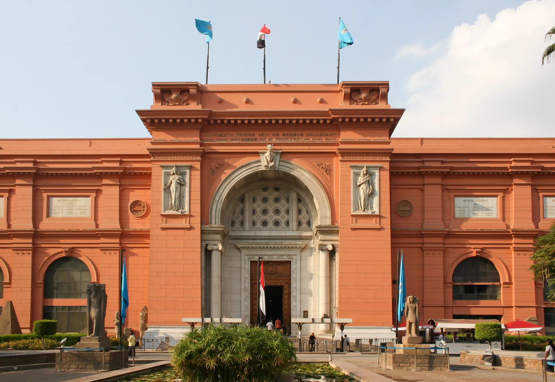 Red neoclassical facade of the Egyptian Museum on Tahrir Square