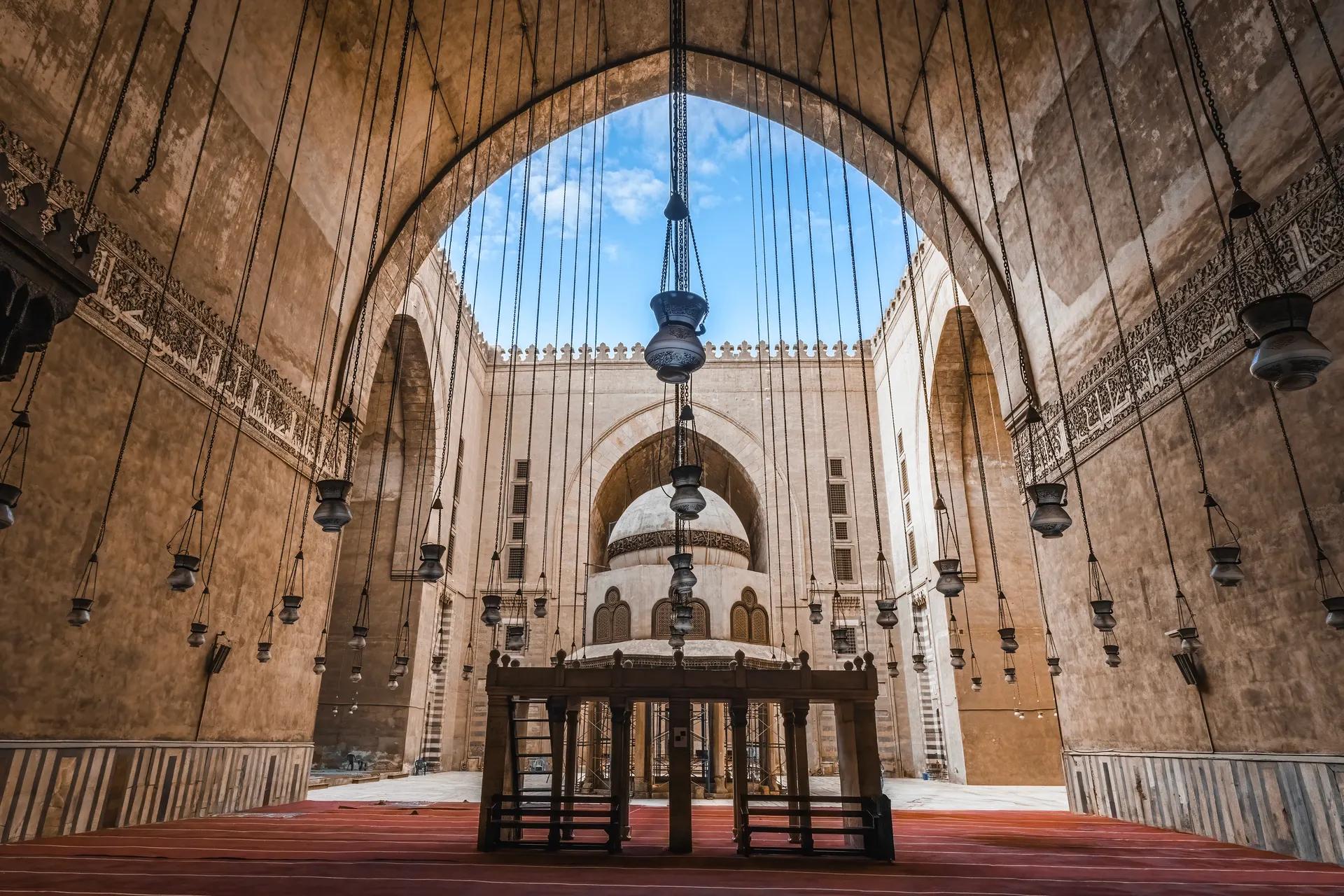 Courtyard of the Mosque-Madrasa of Sultan Hasan with hanging lamps and the central fountain