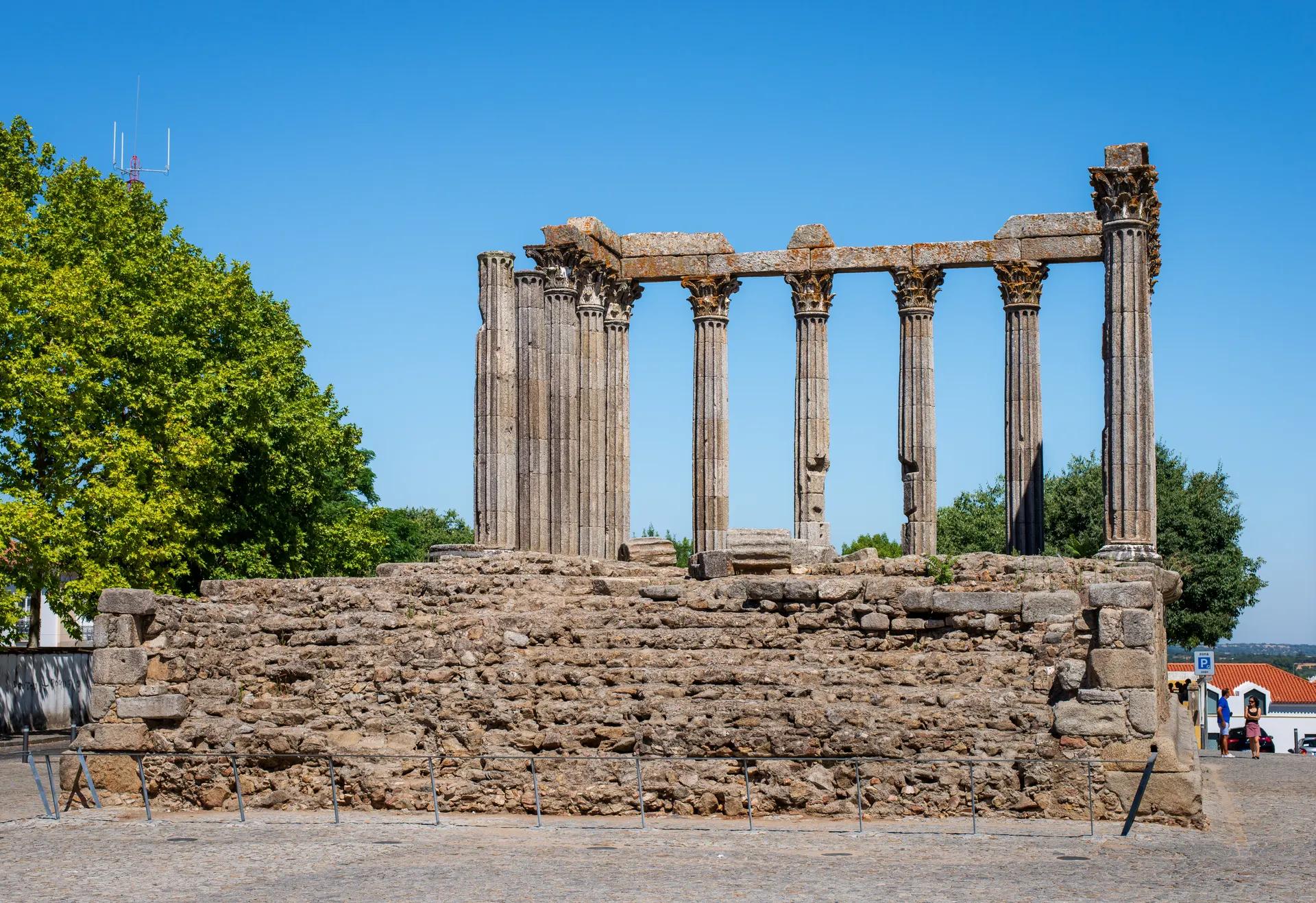 Corinthian columns of the Roman Temple of Évora on its stone podium