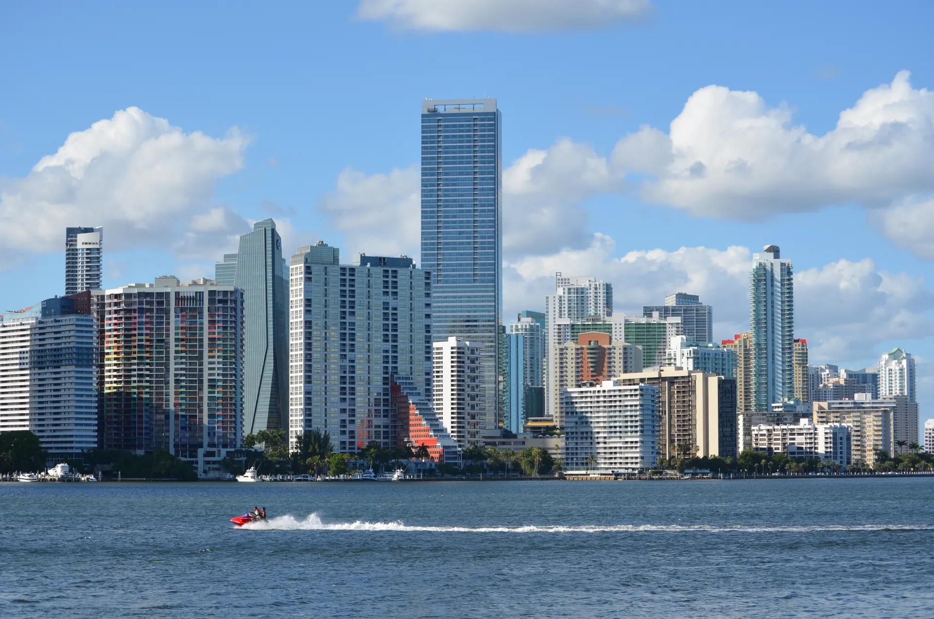 Brickell skyline seen across Biscayne Bay with a jet ski in front
