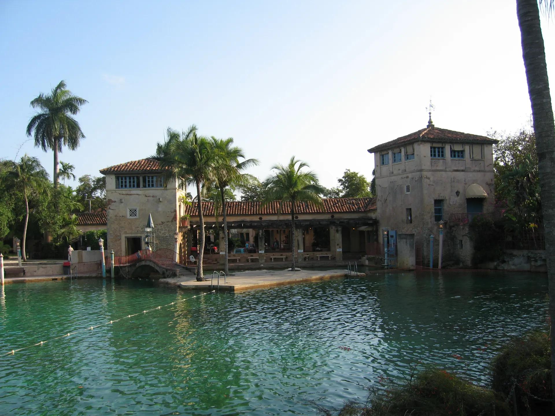 Venetian Pool with its stone towers, loggia and palm trees