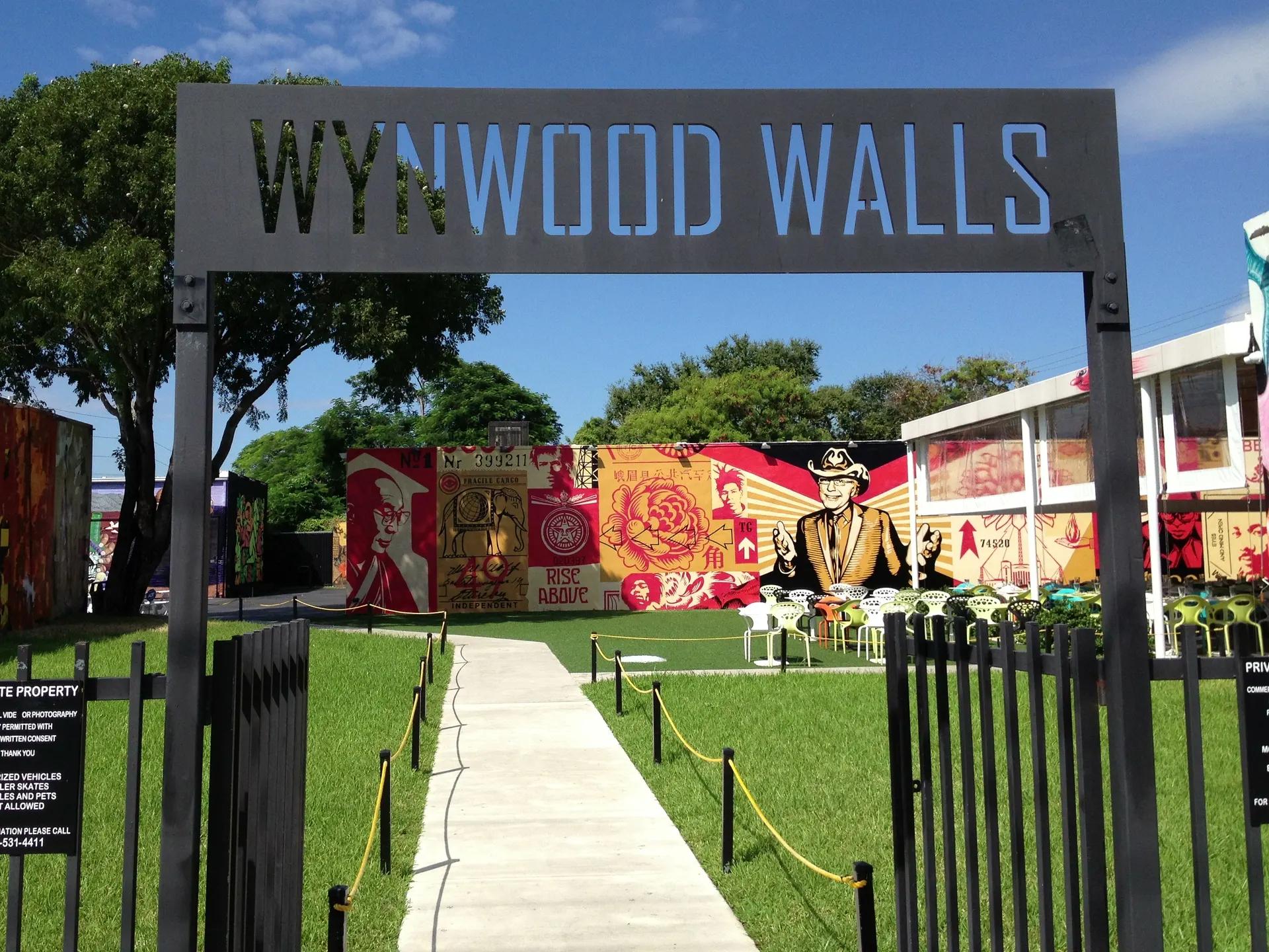 Entrance gate of Wynwood Walls with large murals behind