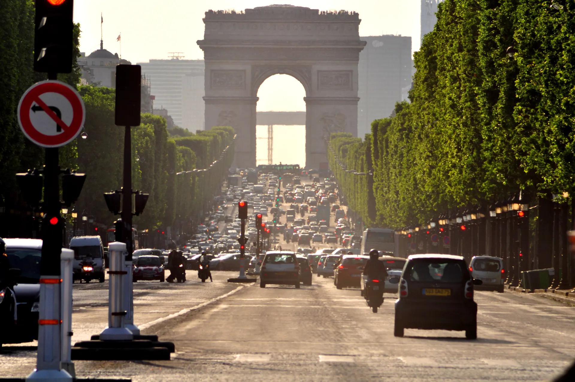 The Arc de Triomphe at the top of the tree-lined Champs-Élysées