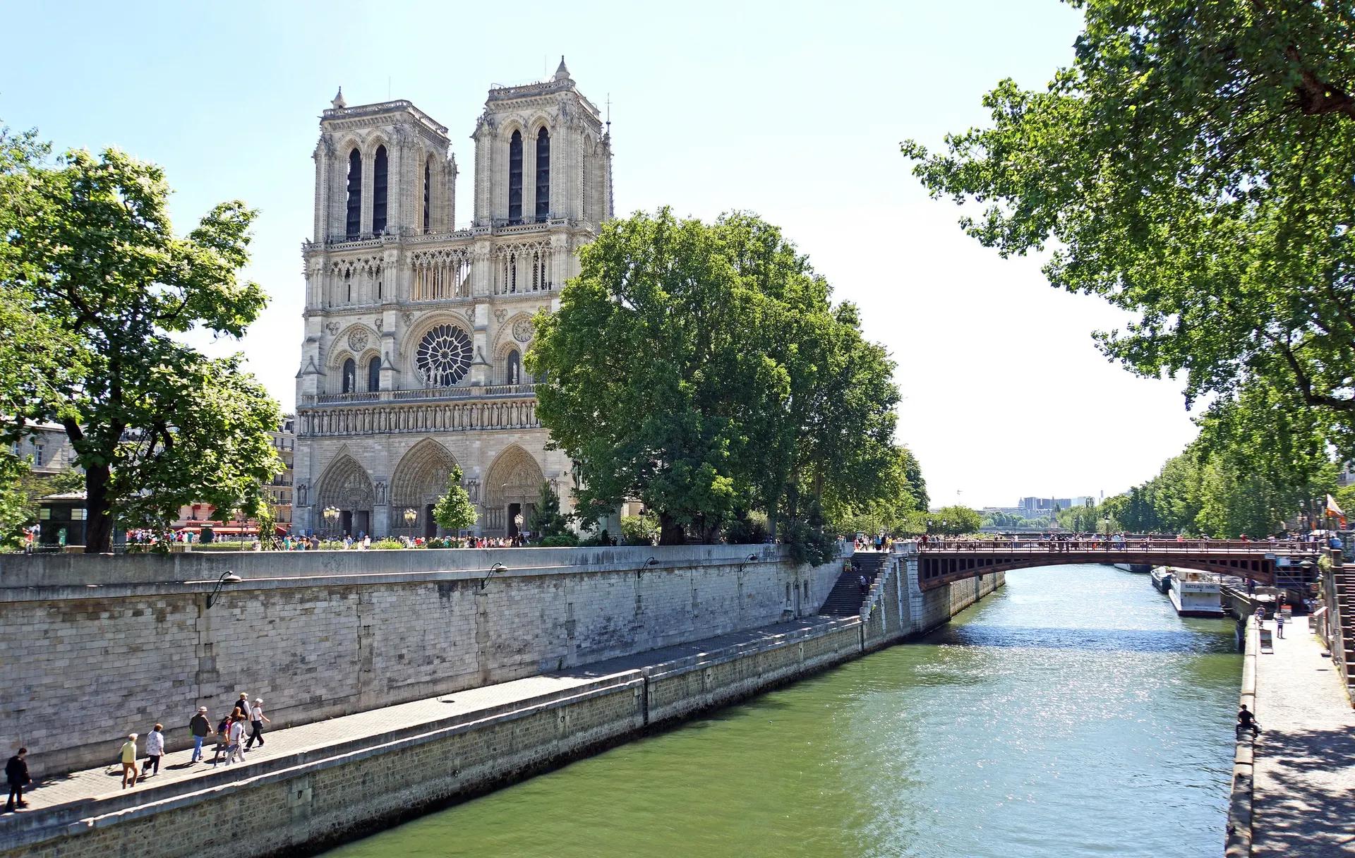West façade and twin towers of Notre-Dame de Paris seen across the Seine