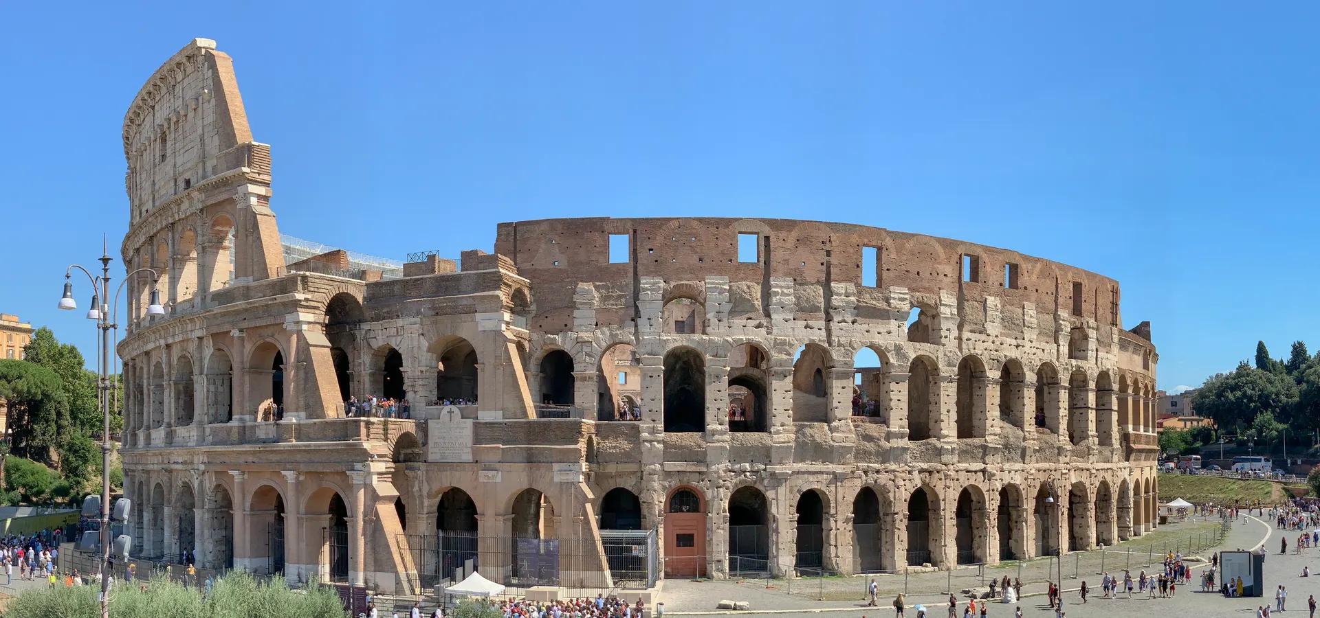 The Colosseum's outer walls under a blue sky