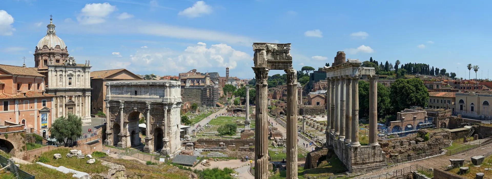 Panorama of the Roman Forum ruins with columns and arches