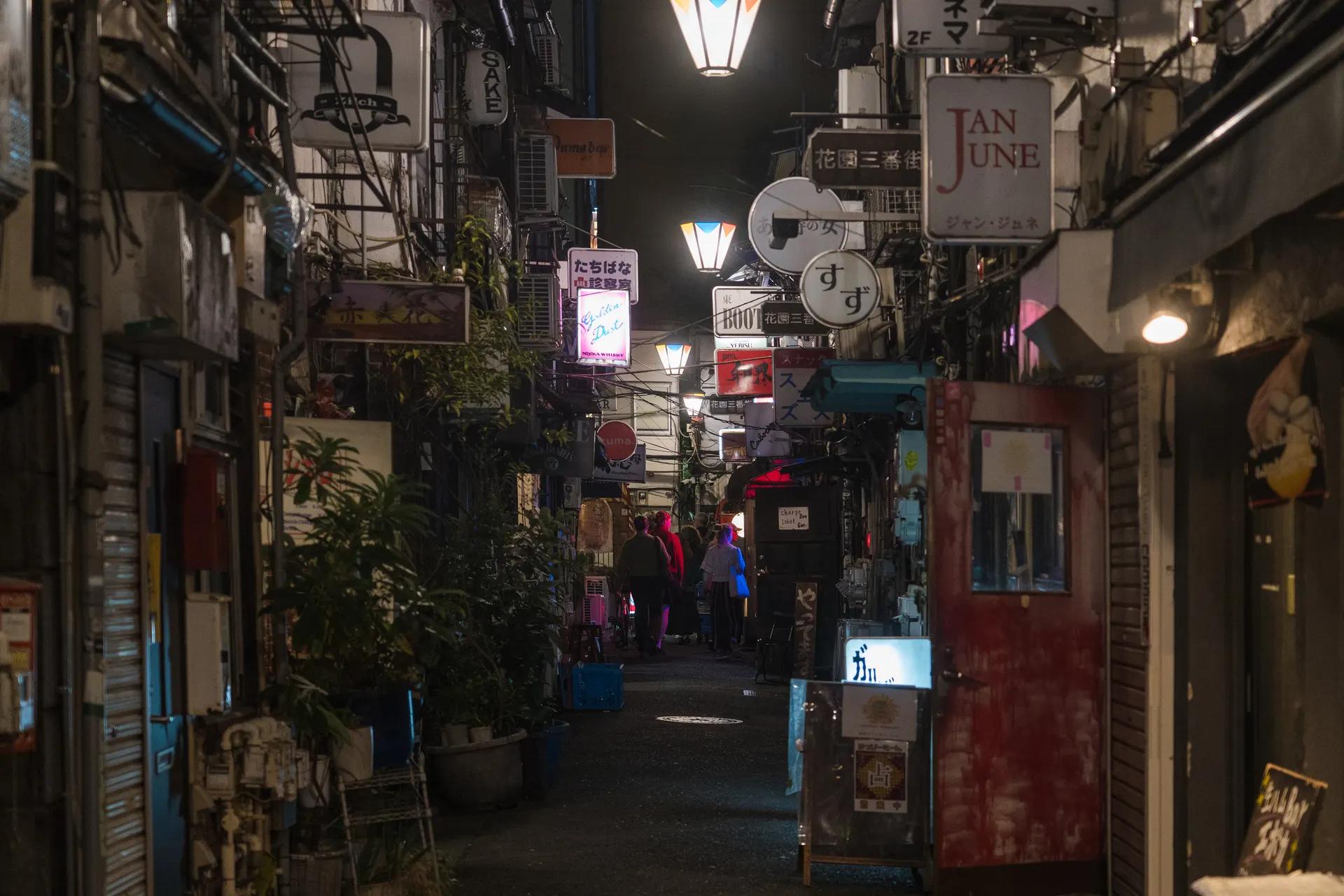 Narrow alley of tiny bars in Shinjuku Golden Gai at night