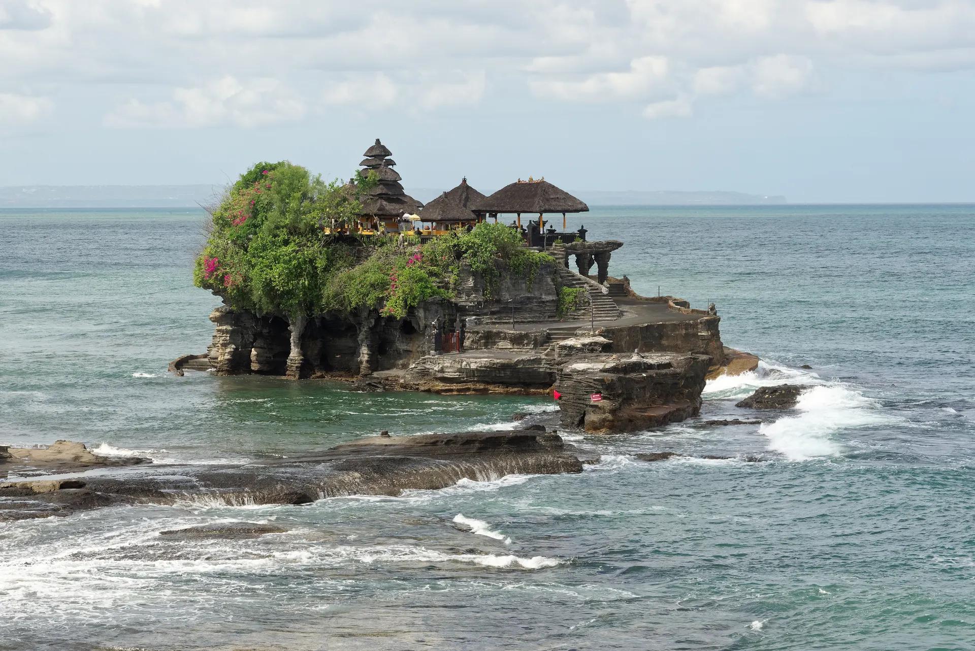 Tanah Lot temple on a rock outcrop at high tide