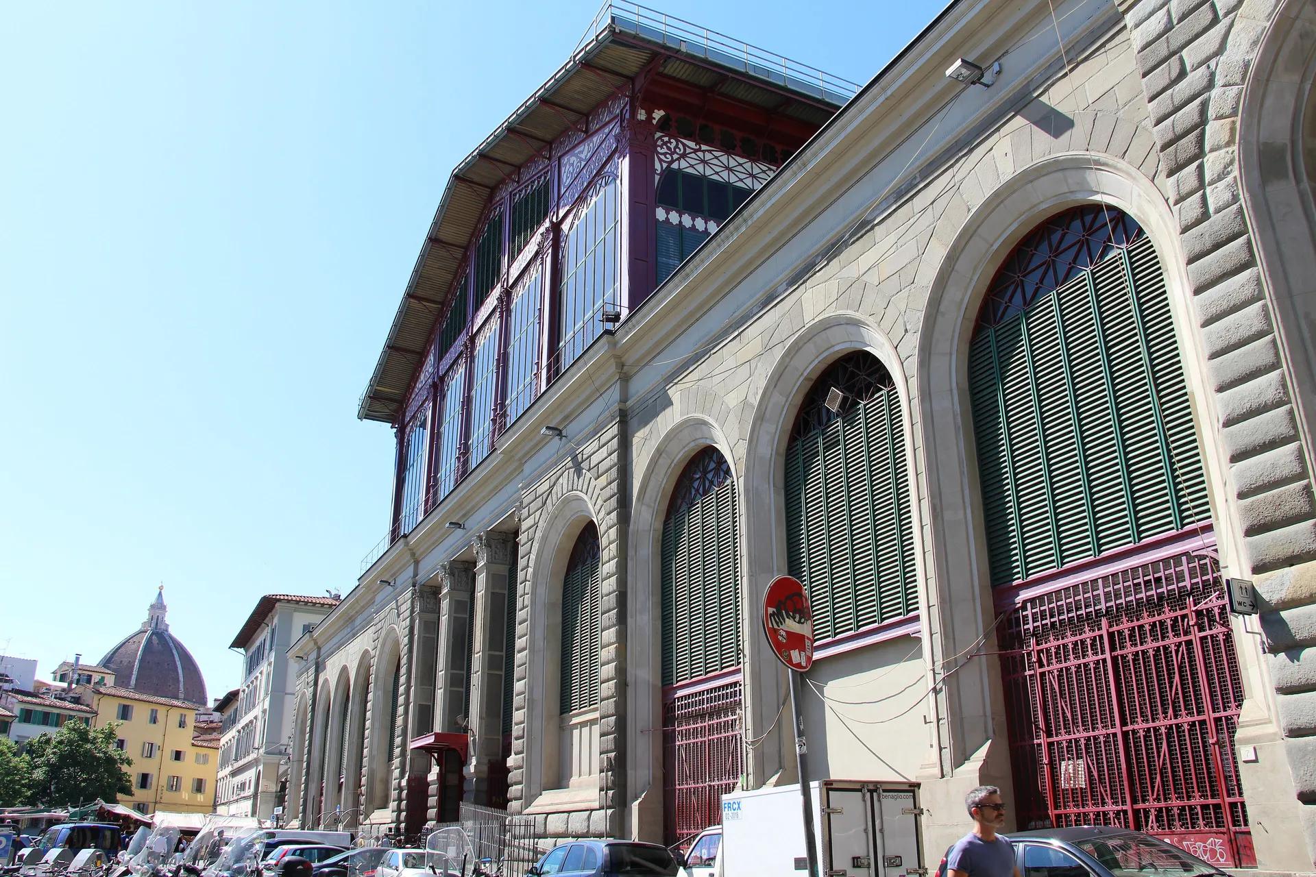 Iron and glass Mercato Centrale building with the cathedral dome in the distance