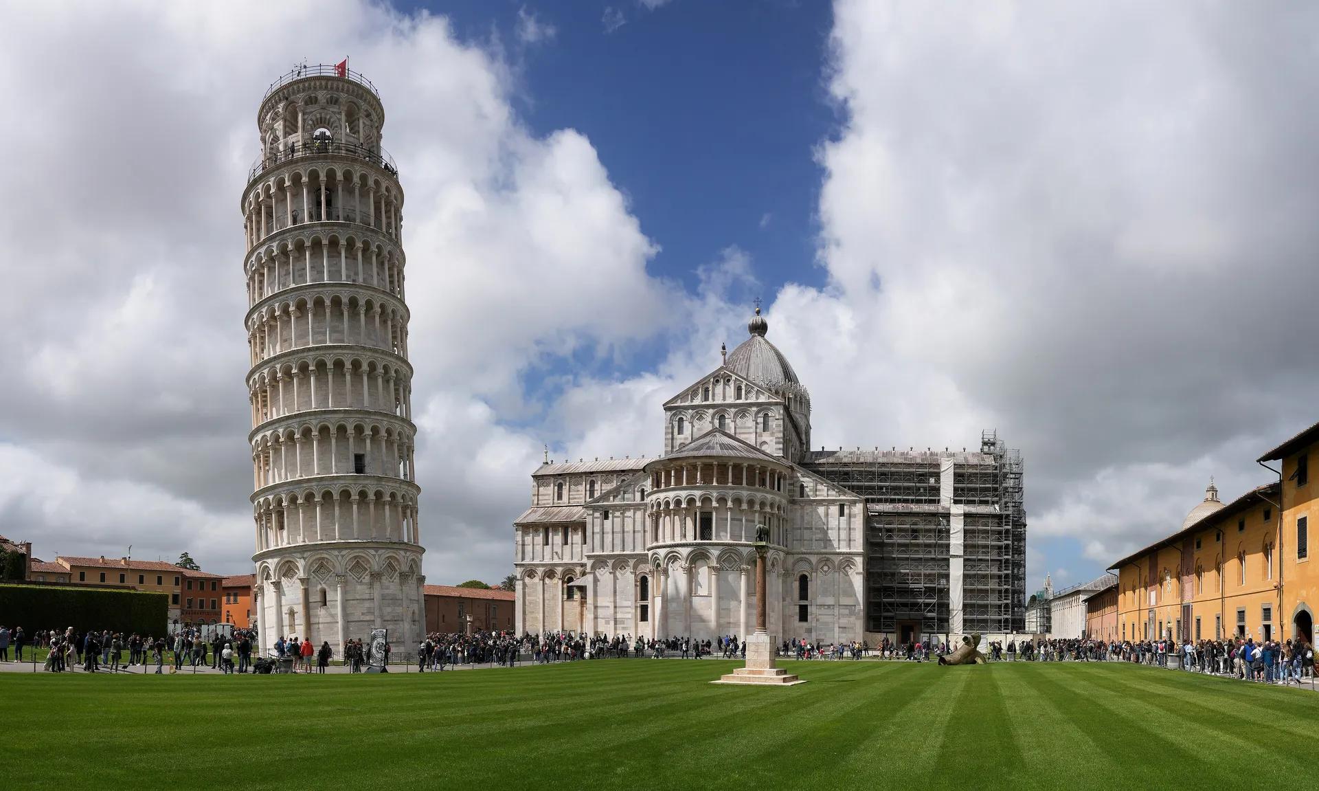 The Leaning Tower and the cathedral on the lawn of Piazza dei Miracoli in Pisa