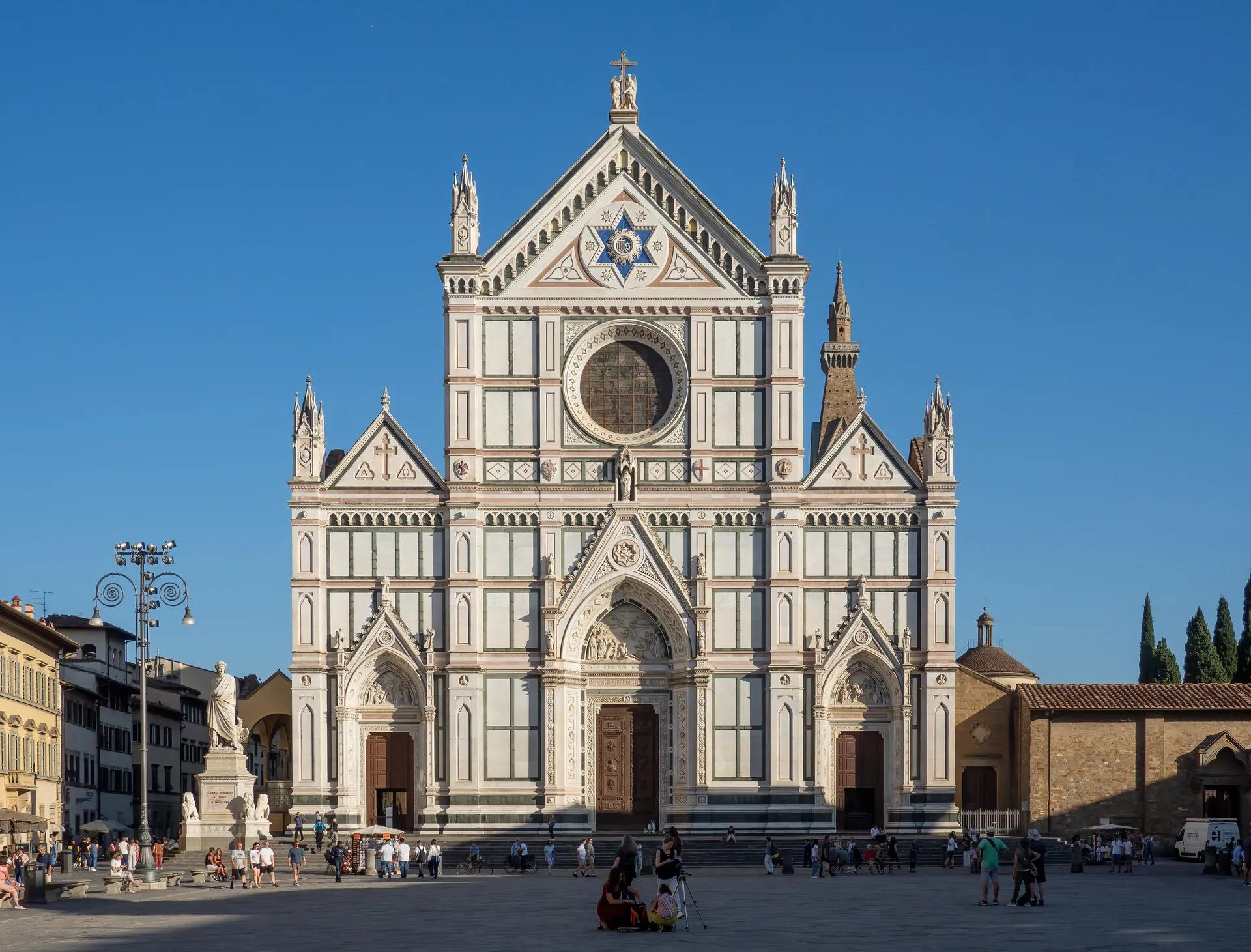 White marble facade of the Basilica of Santa Croce on its square
