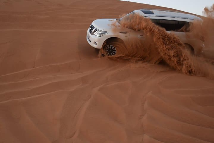 Dune Bashing with Quad Bike and Sand Boarding from Dubai