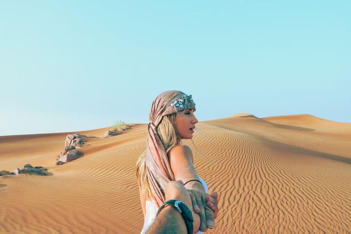 Morning Red Dunes Safari: Camel Ride & Sandboarding Adventure