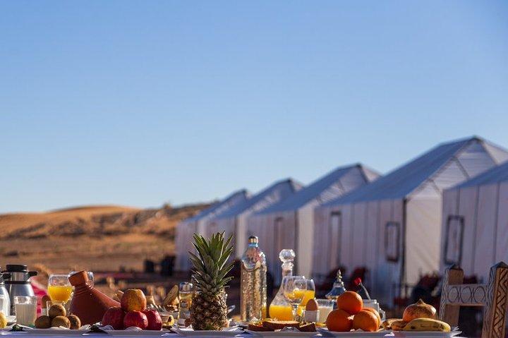 Merzouga: Overnight in Luxury Desert Camp with Camel Ride, meals & sandboarding