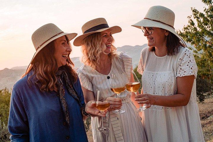 Sunset wine tasting in vineyard