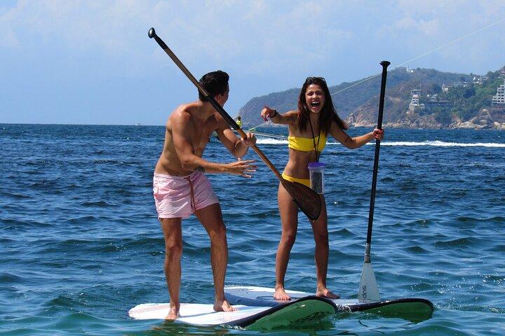 Paddleboarden bij Acapulco's Bay