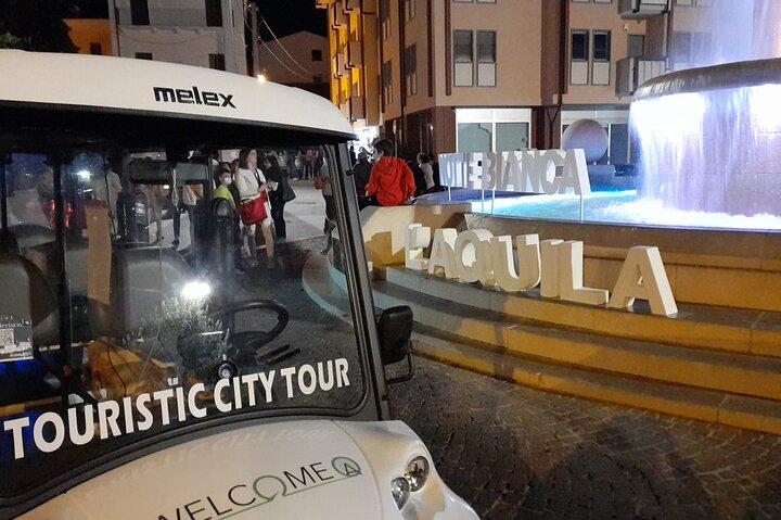Visita turística de L'Aquila a bordo de un servicio de transporte eléctrico
