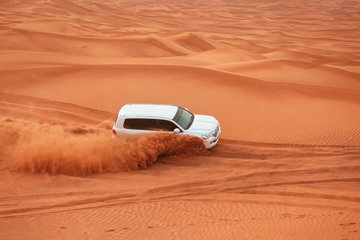 Dubai Desert Safari Dune Bashing, Camel Ride, Sand Boarding, BBQ Dinner.