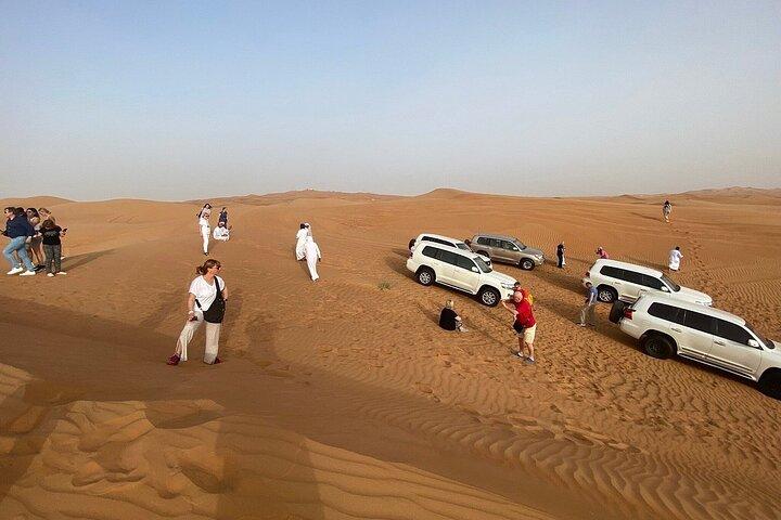 Morgendliche Wüstensafari mit Dune Bashing, Kamelritt, Sandboard & Quad Biking
