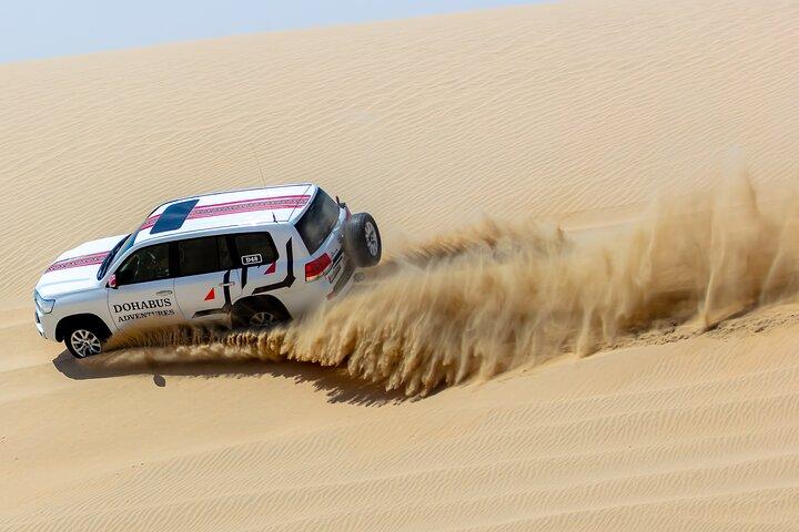 Hele dag woestijnsafari in Qatar: dune bashing, sandboarden, kamelen