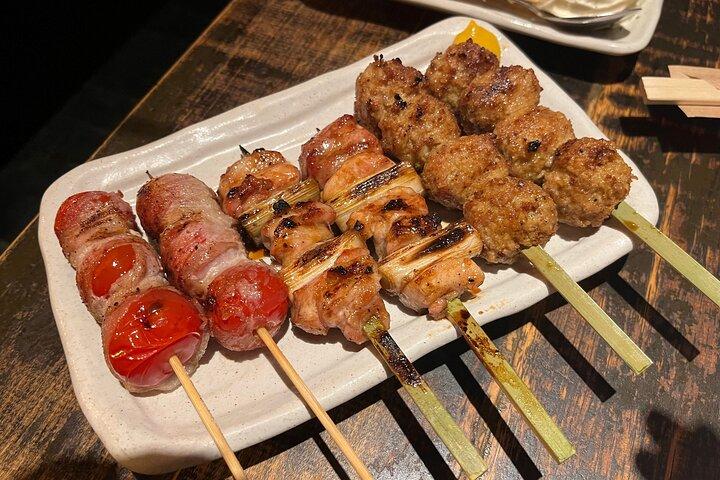 Excursão gastronômica noturna começando em Ginza