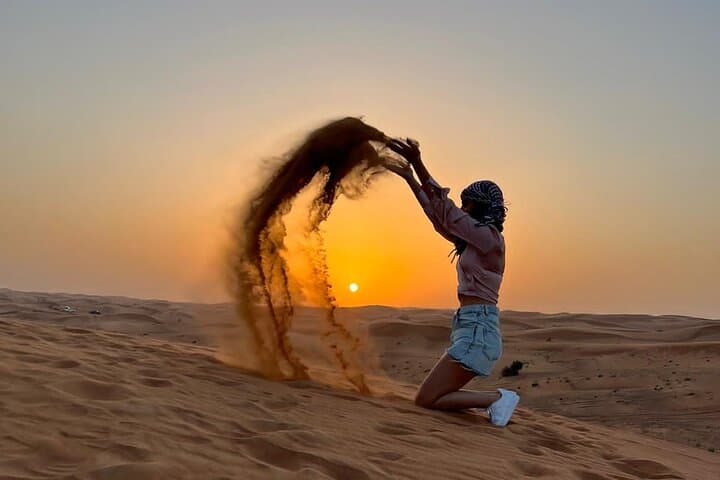 Desert Safari BBQ dinner, Camel ride & sandboarding from Dubai
