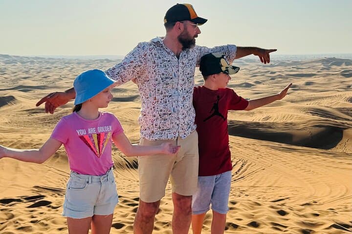 Morning Red Dune Safari with Sandboarding and Camel Ride