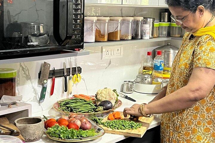 Visite du marché de Chennai et cours de cuisine dans une maison locale avec Meena