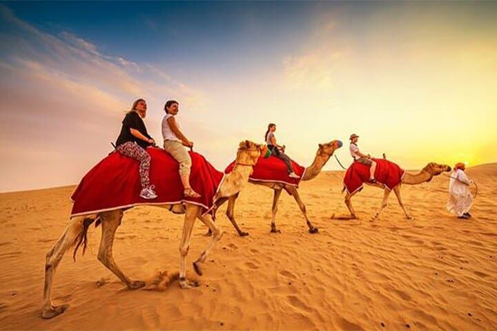 Desert Safari Dubai Tour with Dune Bashing, Camel Ride, & BBQ