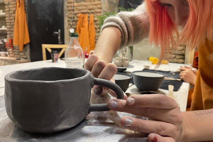 Officina ceramica di costruzione a mano con servizio di ritiro