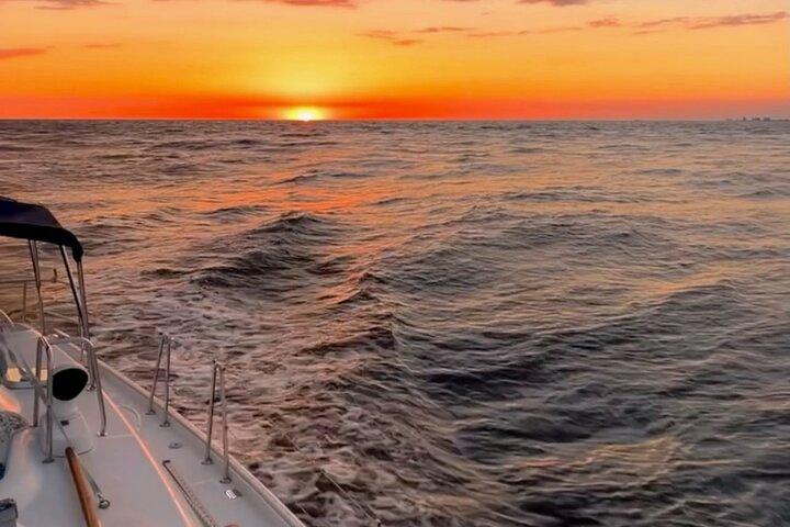 Sunset Dolphin Sail Aboard the Daydreams Sailboat