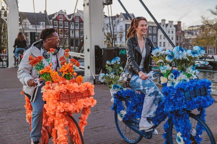 Explore Amsterdam canals on iconic Flower Bikes