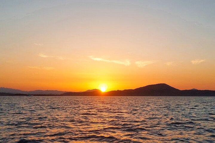 Boat Sunset Aperitif Tour in Tavolara and Molara