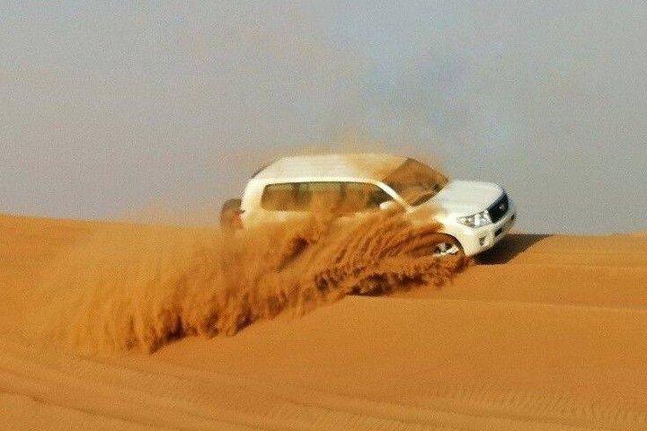 Dubai Desert Safari with Quad Biking Camel Riding and BBQ Dinner