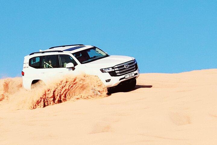 Morning Red Dunes Desert Safari With Camel Ride And Sand Boarding