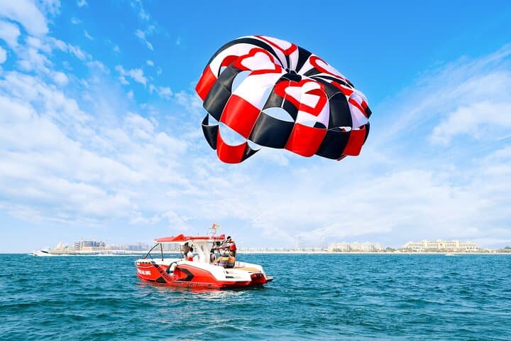 Parasailing in Dubai with Palm Jumeirah and JBR Beach views