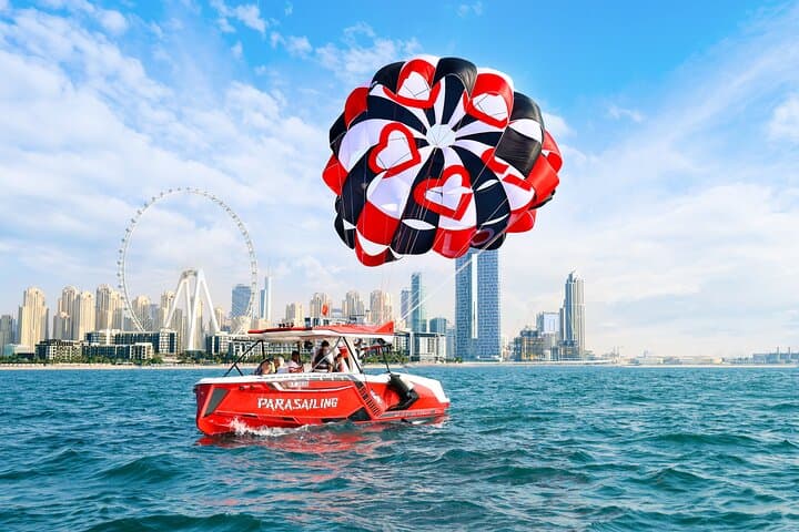 Parasailing in Dubai with Palm Jumeirah and JBR Beach views