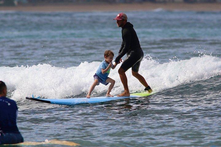 Tandem surflektion i Oahu