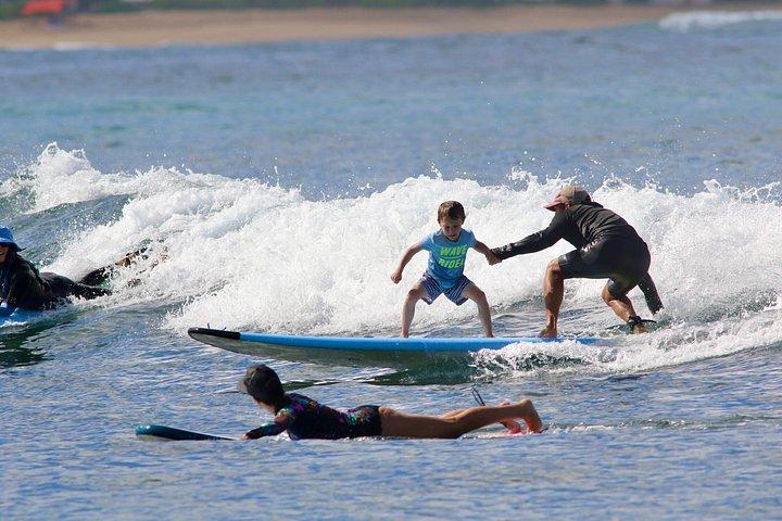 Tandem surflektion i Oahu