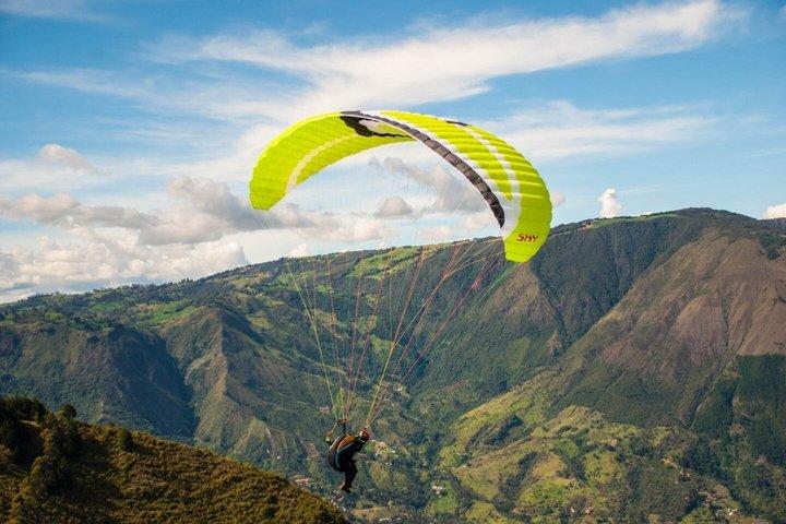 Paragliding flight over Medellin from San Felix with Transportation