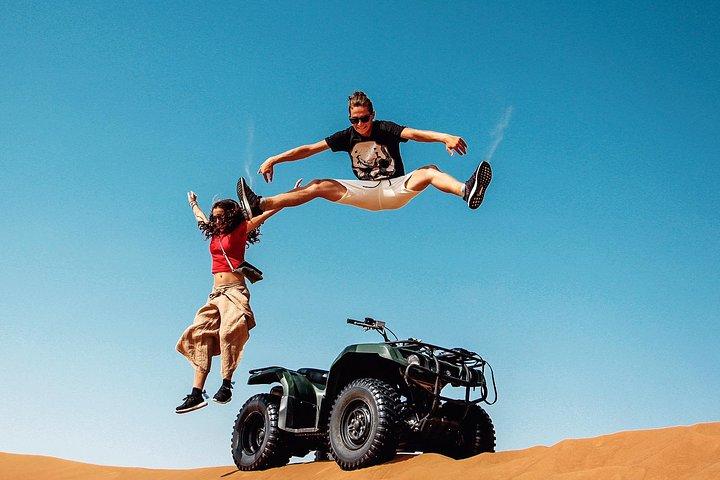 Dubai: Quad Bike Tour with Camel Ride, Sand Boarding & BBQ