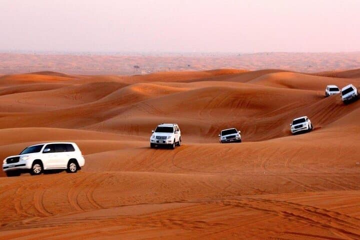Morning Desert Safari with Quad Bike & Camel Ride & Sandboarding