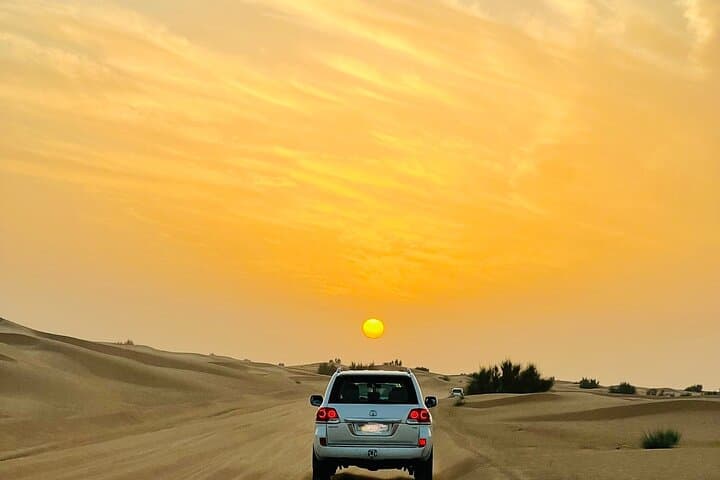 Sunset Safari with BBQ Dune Drive Camel Ride & Dune Buggy option