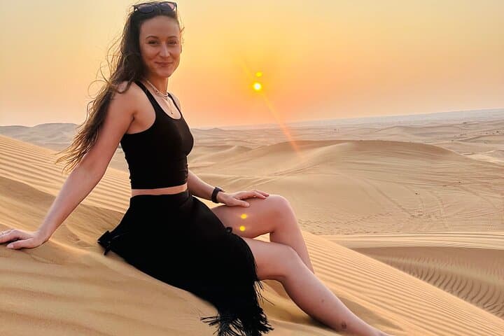 Red Desert safari Dubai with Camel Ride Sand Board & BBQ Dinner